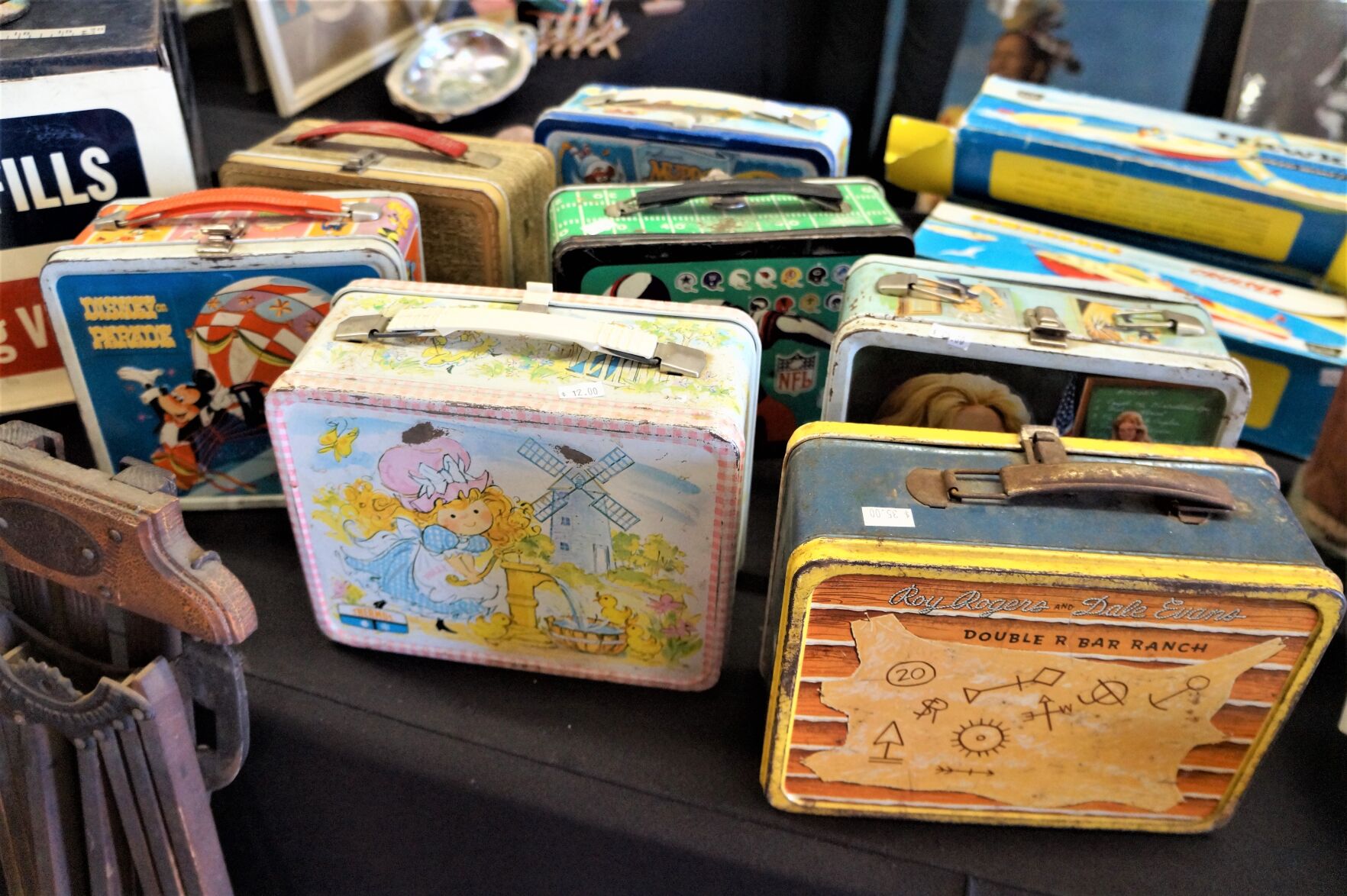 Vintage metal lunch boxes on display